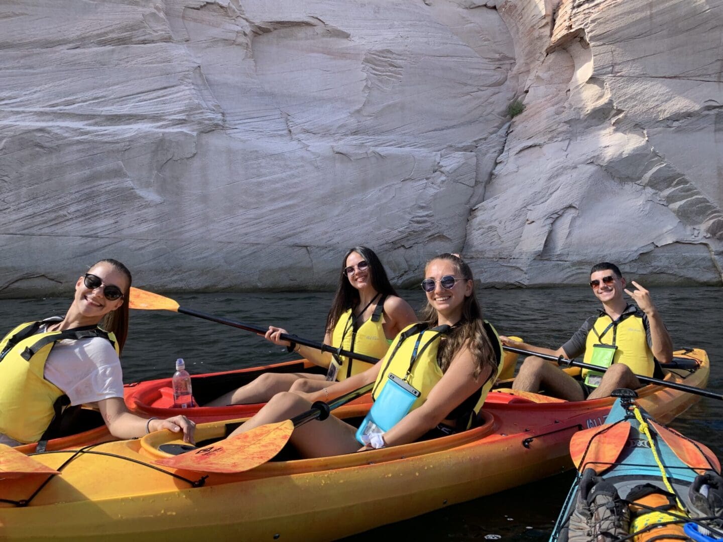 A group of people in kayaks on the water.